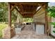 Covered patio with built-in seating and grilling area at 12200 Treetop Ct, Orlando, FL 32832