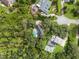 Aerial view of a neighborhood with houses and trees at 12200 Treetop Ct, Orlando, FL 32832