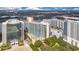 Aerial view of a modern high rise building near a lake at 322 E Central Blvd # 1214, Orlando, FL 32801