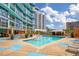 Resort-style pool with lounge chairs and a relaxing patio area at 322 E Central Blvd # 1214, Orlando, FL 32801