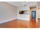 Living room with hardwood floors and kitchen passthrough at 322 E Central Blvd # 1214, Orlando, FL 32801