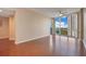 Living room with hardwood floors, large window, and city view at 322 E Central Blvd # 1214, Orlando, FL 32801