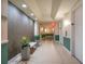 Building hallway with tile floors, plants, and neutral colors at 322 E Central Blvd # 1214, Orlando, FL 32801