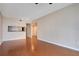 Living room with hardwood floors and kitchen passthrough at 322 E Central Blvd # 1214, Orlando, FL 32801