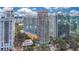 Aerial view of a high-rise building in the city with surrounding buildings and lake at 322 E Central Blvd # 1214, Orlando, FL 32801