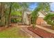 Brick and siding exterior with a pergola and landscaped yard at 185 Post Way, Casselberry, FL 32707