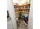 Well-stocked pantry with ample shelving for storage at 2772 S Huron Dr, Deltona, FL 32738