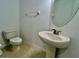 Simple bathroom with pedestal sink and toilet at 1431 Pacific Rd, Poinciana, FL 34759