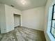 Bright bedroom featuring a large window and a walk-in closet at 1431 Pacific Rd, Poinciana, FL 34759