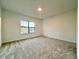 Well-lit bedroom featuring a large window and view at 1431 Pacific Rd, Poinciana, FL 34759