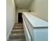 Modern staircase with neutral tones and a clean, simple design at 1431 Pacific Rd, Poinciana, FL 34759