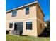 Townhome with small grassy backyard and patio furniture at 1431 Pacific Rd, Poinciana, FL 34759