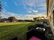 Spacious backyard with a view of the community and a sunset at 1431 Pacific Rd, Poinciana, FL 34759