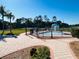 Community pool with a fun water feature, tennis courts, and a gated entrance at 1431 Pacific Rd, Poinciana, FL 34759