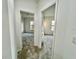Bright hallway with doors to bedrooms at 1431 Pacific Rd, Poinciana, FL 34759