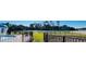 Resort-style pool, tennis courts, and lush green landscaping at 1431 Pacific Rd, Poinciana, FL 34759