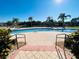 Community pool with surrounding patio and landscaping at 1431 Pacific Rd, Poinciana, FL 34759