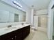 Bathroom with double vanity, shower/tub combo at 1431 Pacific Rd, Poinciana, FL 34759