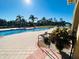 Community pool with patio and lounge chairs at 1431 Pacific Rd, Poinciana, FL 34759