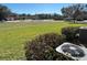 Open green space with a view of homes and trees at 1431 Pacific Rd, Poinciana, FL 34759