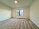 Bedroom with large window and sunset view at 1431 Pacific Rd, Poinciana, FL 34759