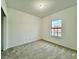 Spacious bedroom with a large window and plush carpeting at 1431 Pacific Rd, Poinciana, FL 34759