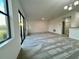 Open living room with sliding glass doors leading to a patio at 1431 Pacific Rd, Poinciana, FL 34759