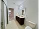 Modern bathroom with double vanity and updated fixtures at 1431 Pacific Rd, Poinciana, FL 34759