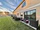 Townhouse exterior view with patio and sunset at 1431 Pacific Rd, Poinciana, FL 34759