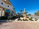 Community entrance with a large fountain and landscaping at 1431 Pacific Rd, Poinciana, FL 34759