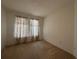 Well-lit bedroom featuring patterned curtains and carpet at 11434 Jasper Kay Ter # 306, Windermere, FL 34786
