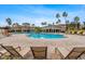 Community pool with lounge chairs and shaded areas at 11434 Jasper Kay Ter # 306, Windermere, FL 34786