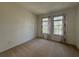 Bright bedroom with two windows and neutral decor at 11434 Jasper Kay Ter # 306, Windermere, FL 34786