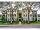 Three-story building exterior with landscaping and parking at 11434 Jasper Kay Ter # 306, Windermere, FL 34786
