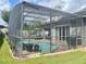 Screened pool and patio area with surrounding landscaping at 8038 Glitter Ct, Orlando, FL 32836