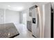 Stainless steel refrigerator in modern kitchen with gray cabinets at 5480 Palomino Pl, Apopka, FL 32712