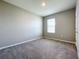 Bright and airy bedroom with neutral walls and carpet at 5480 Palomino Pl, Apopka, FL 32712