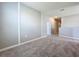 Spacious bedroom with grey walls and carpeted floor at 5480 Palomino Pl, Apopka, FL 32712