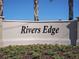 Rivers Edge community entrance sign at 2128 Gentle Rain Dr, Edgewater, FL 32141