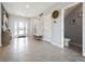 Bright and airy entryway with tile flooring and half bathroom at 2130 Gentle Rain Dr, Edgewater, FL 32141