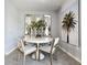 Modern dining area featuring a round table and stylish decor at 2132 Gentle Rain Dr, Edgewater, FL 32141