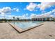 Community lap pool with spacious deck and lounge chairs at 2717 Greenlands St, St Cloud, FL 34772