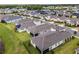 Aerial view of houses with solar panels, showcasing community at 2717 Greenlands St, St Cloud, FL 34772