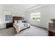 Bright bedroom with large window and plush carpeting at 2717 Greenlands St, St Cloud, FL 34772