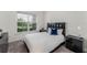Cozy bedroom with a window and modern nightstands at 2717 Greenlands St, St Cloud, FL 34772