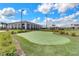 Community clubhouse with putting green and outdoor seating at 2717 Greenlands St, St Cloud, FL 34772