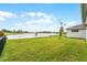 Spacious backyard with lake view and lush grass at 2717 Greenlands St, Saint Cloud, FL 34772