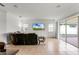 Relaxing living room with sliding glass doors to patio at 2717 Greenlands St, St Cloud, FL 34772