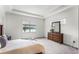 Bright bedroom with water view and dresser at 2717 Greenlands St, St Cloud, FL 34772