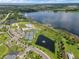 Community overview with lake, pool, tennis courts, and clubhouse at 2717 Greenlands St, St Cloud, FL 34772